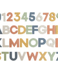 The mushie Letters & Numbers Bath Play Set features foam 0-9 and A-Z pieces in blue, green, orange, yellow, and white. Arranged in four rows on a white background, these toys provide educational fun during bath time.