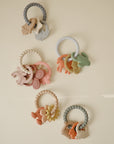 Mushie Fairy Teething Ring: a colorful, food-grade silicone teether for sensory baby fun.