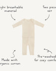 The mushie Two Piece Set is a cream-colored, long sleeve shirt and pants set for toddlers in ribbed fabric, featuring breathable organic cotton, pre-washed comfort, and a cozy design for baby clothing.