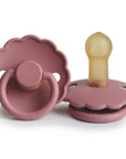 The FRIGG Daisy Natural Rubber Pacifier 2-Pack in Dusty Rose features two scalloped-edge pacifiers—one upright, one flat—each displaying the FRIGG brand name.