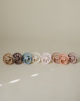 Two FRIGG Andersen Fairytale Silicone Pacifiers rest side by side on a neutral background.