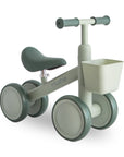 Sage Mini Toddler Bike by mushie with a front basket and four thick wheels.