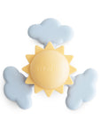 The mushie Suction Spinner Toy in Sunshine features a yellow sun shape and three light blue clouds, all crafted from food-grade silicone and displayed on a white background.