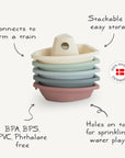 Mushie Bath Boats: Set of five pastel stackable boats made in Denmark from non-toxic plastic. Connect to form a train, sprinkle water with holes—safe and fun for bath time!.