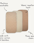 Mushie Changing Pad Liners include three rectangular muslin liners in checkered and solid designs, made from organic cotton and bamboo. They’re machine washable, water repellent, and ideal for keeping diaper changing pads clean.