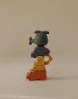 The mushie Vehicles Mold Free Bath Play Set displays a green helicopter, blue car, yellow excavator, and orange truck stacked vertically against a plain beige background.