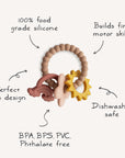 The mushie Nature Teething Ring features beads and textured rings in neutral colors, made from 100% food-grade silicone. It's BPA/BPS/PVC/phthalate-free, easy to grip, stimulates senses, and is dishwasher safe.