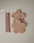 Set of two mushie Silicone Sensory Toys with colorful sticks, great for fine motor play.