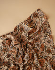 Lifestyle image of Organic Cotton Swaddle in Retro Flowers