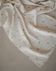 Lifestyle image of Organic Cotton Swaddle in Dinosaur