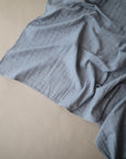 Lifestyle image of Organic Cotton Swaddle in Tradewinds