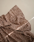 Lifestyle image of Organic Cotton Swaddle, Leopard