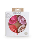 Packaged pink and red Rosy Romance Frigg baby pacifiers on a white background