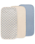 Mushie Changing Pad Liners: three overlapping—checkered, beige, and blue.
