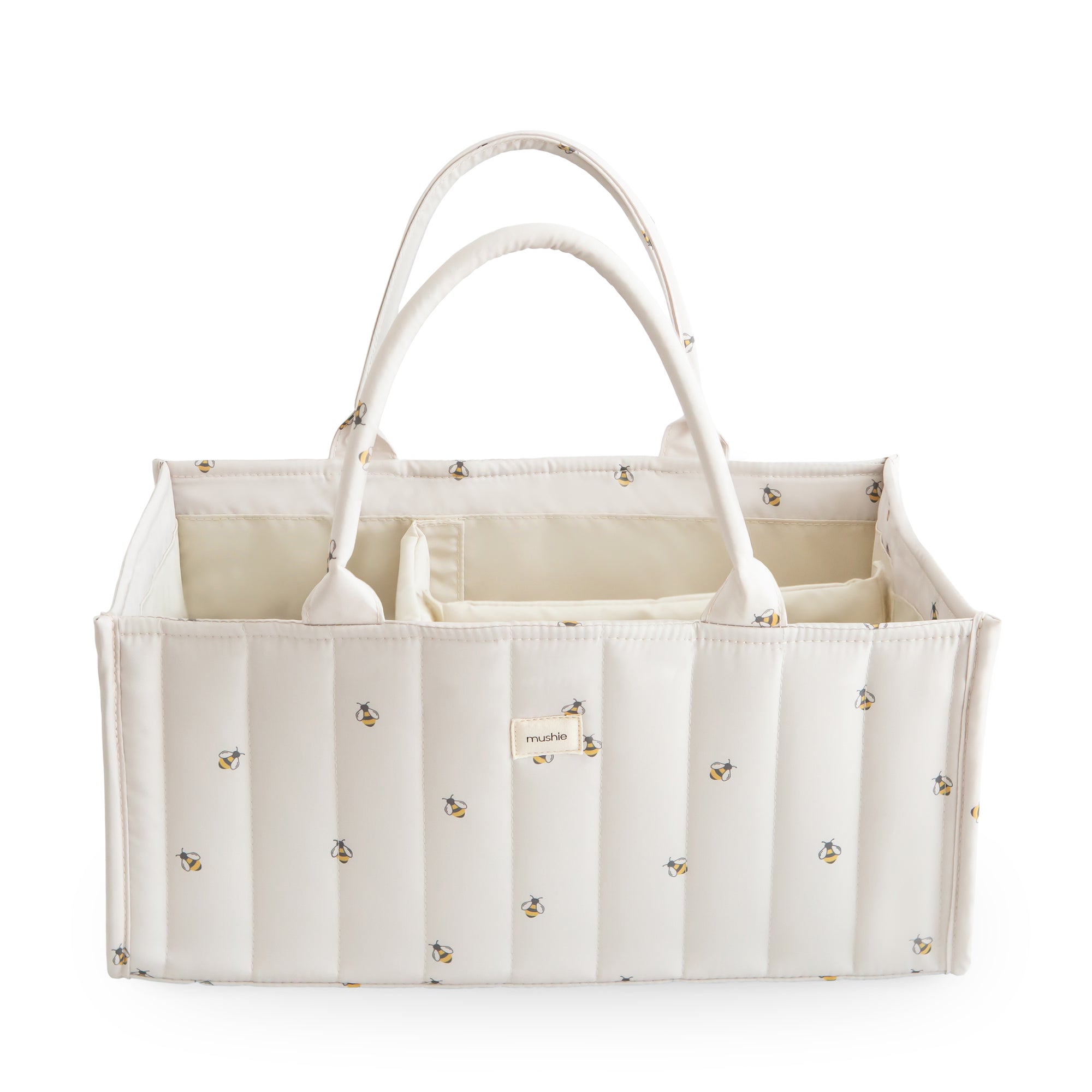 Mushie Diaper Caddy: Cream quilted tote with floral print, ideal for stylish organization.