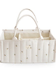 Mushie Diaper Caddy: Cream quilted tote with floral print, ideal for stylish organization.