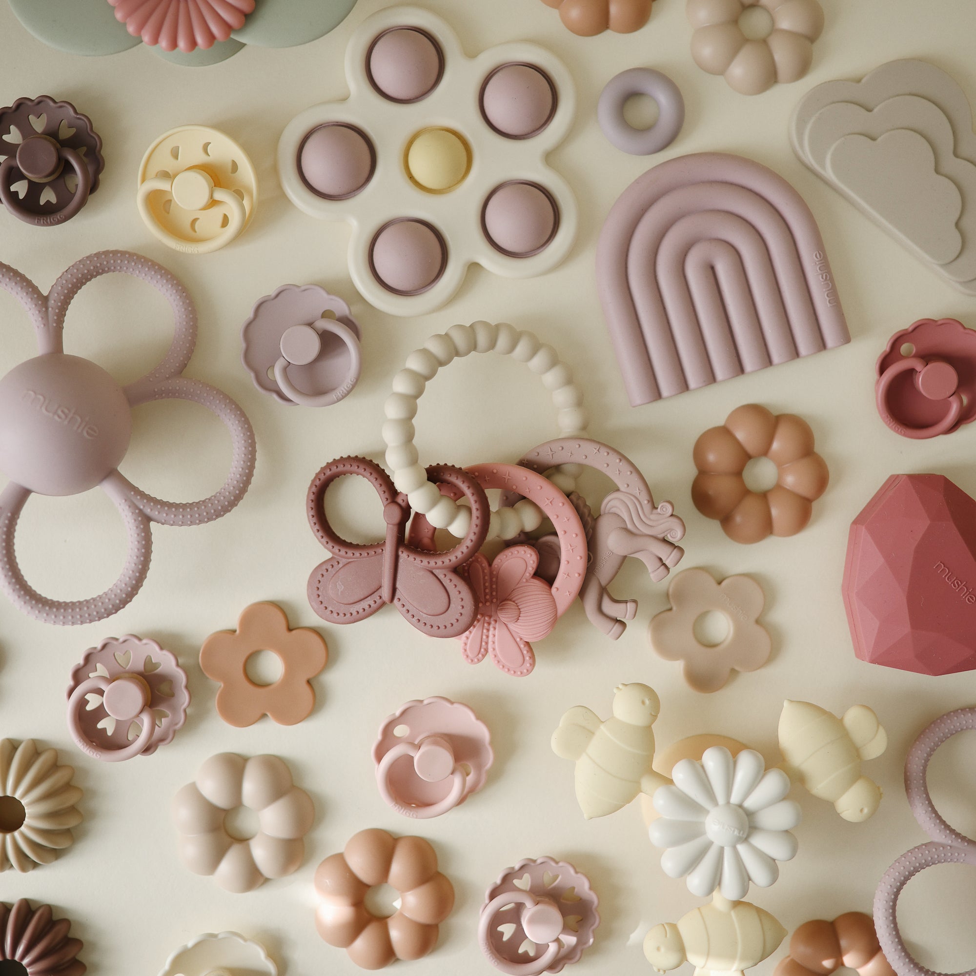 a Mushie Fairy Teething Ring that has silicone and is a baby toy for sensory exploration.