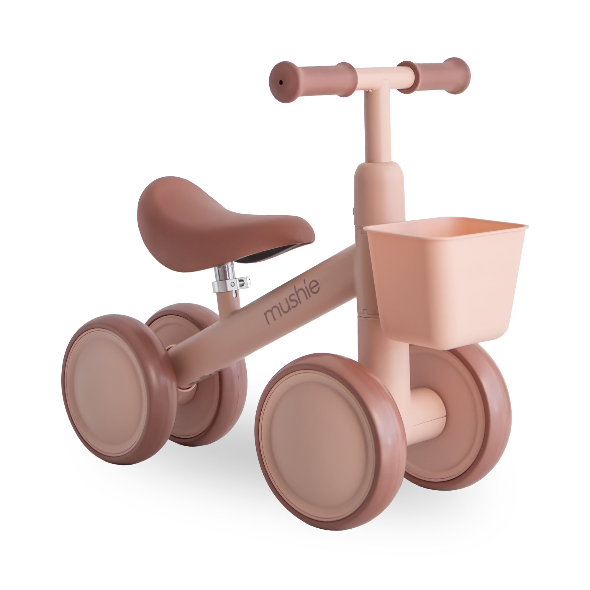 Mushie Mini Toddler Bike in Blush with front basket—ideal as a toddler's first bike.