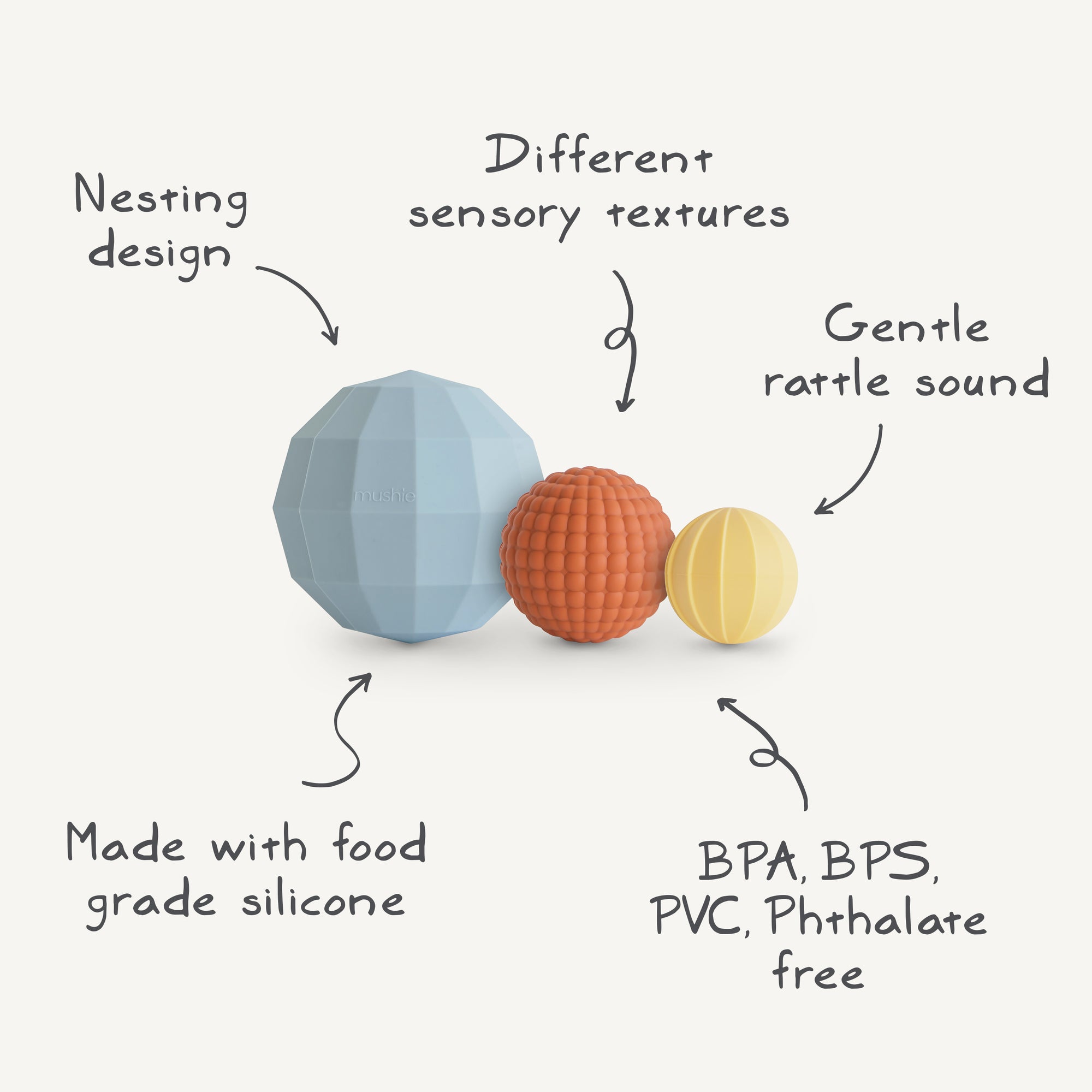 The mushie Nesting Spheres Sensory Toy features three uniquely textured silicone balls that nest together, provide gentle rattle sounds, and are made from food-grade silicone free of BPA, BPS, PVC, and phthalates for safe baby development.