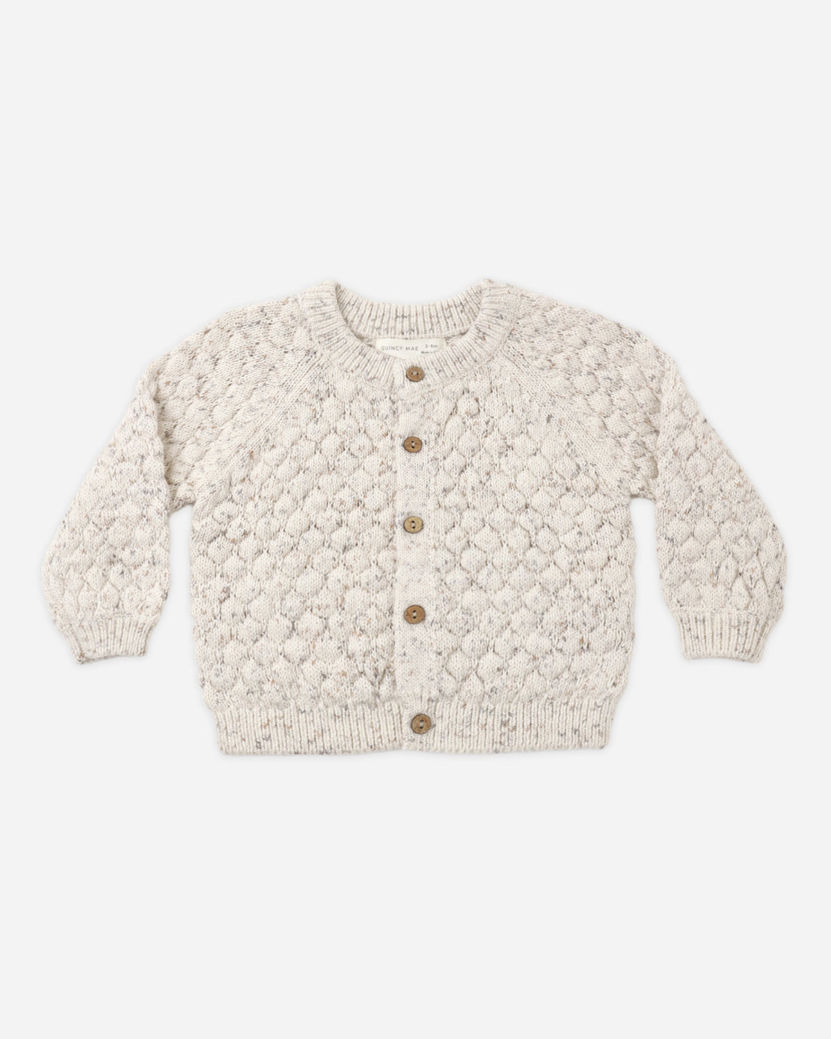 Rylee + Cru Bubble Knit Cardigan Natural Confetti, cream with brown buttons, laid flat on white.