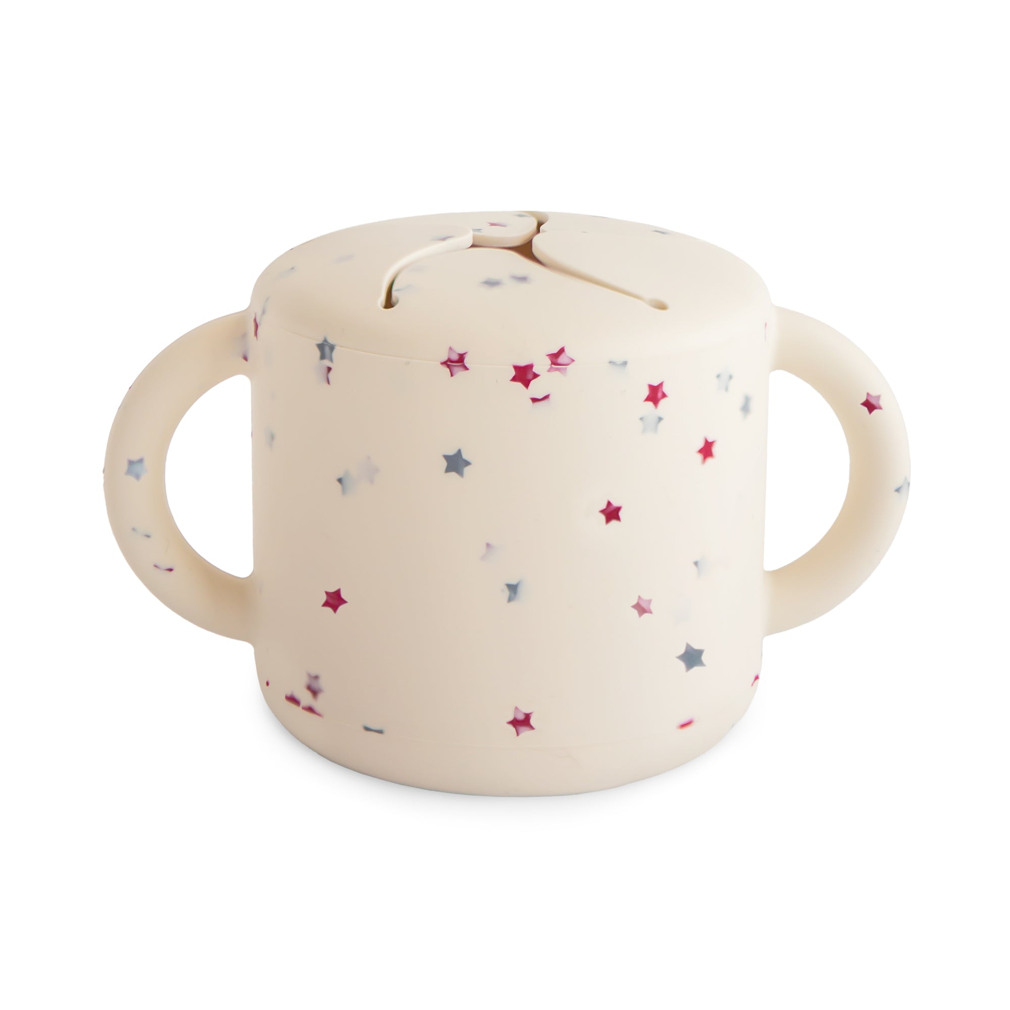 Mushie Snack Cup: cream silicone, two handles, pink & blue star patterns.