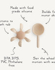 The mushie Water Wheel Bath Toy includes a beige, flower-shaped water wheel with suction cups and a scoop. Made from food-grade silicone and free from BPA, BPS, PVC, and phthalates, it encourages motor skills and fun at bath time.