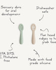 Two Mushie First Feeding Baby Spoons, one green and one beige, feature sensory dots, ridged flat heads, and are made from food grade silicone. They’re BPA/BPS/PVC/phthalate free and dishwasher safe—perfect for first feedings.