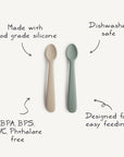 Mushie Silicone Feeding Spoons come in beige and green, made from food-grade silicone. BPA, BPS, PVC, and phthalate free, they're soft for gentle feeding and dishwasher safe for easy cleaning.