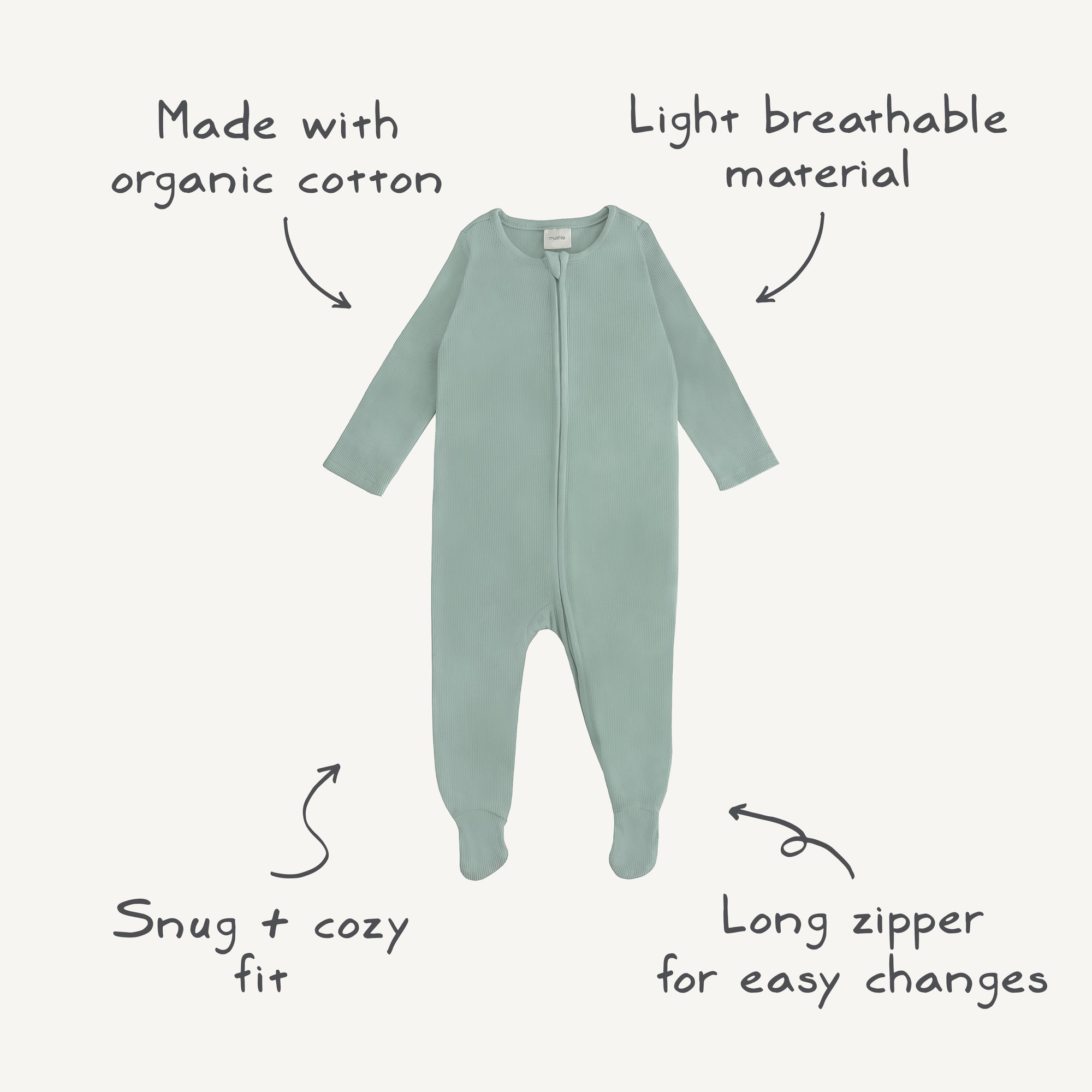 Mushie Zipper Pajama: light green organic cotton, long sleeves, zipper, and feature details.